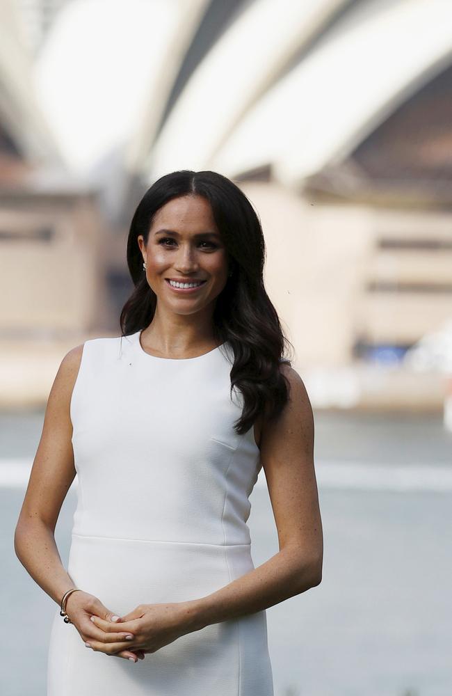 Meghan gave the world the first glimpse of her bump on Monday