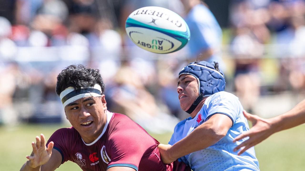 Queensland Agapes Lote Felo tackled by Flynn Farrell. Picture: Julian Andrews