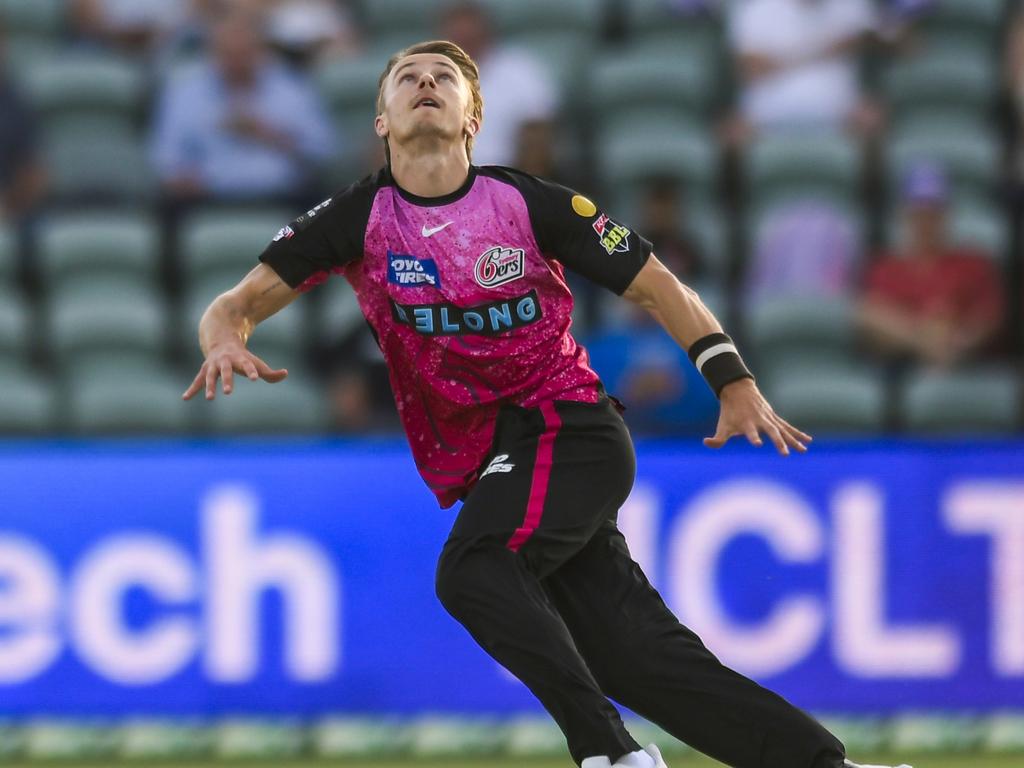 Tom Curran attempts a catch during the Sixers’ match against Hobart. Picture: Simon Sturzaker/Getty Images