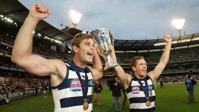 Tom Hawkins and Joel Selwood after knocking off the Pies in 2011.