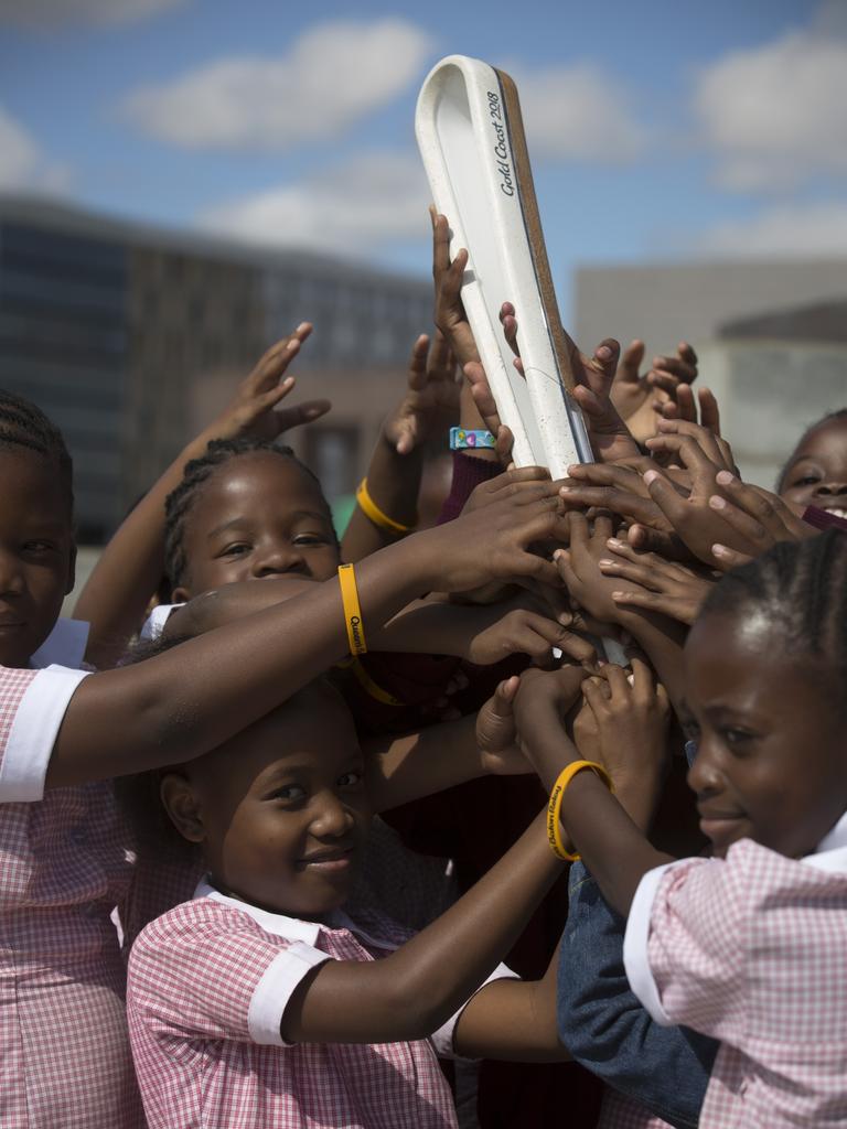 The Queen’s Baton arrived in Gaborone, the capital city of Botswana on 1 May, 2017, where it took part in the relay across the city and a visit to a school. Photograph shows a group of schoolchildren with the Baton at the Dikgosi Monument.