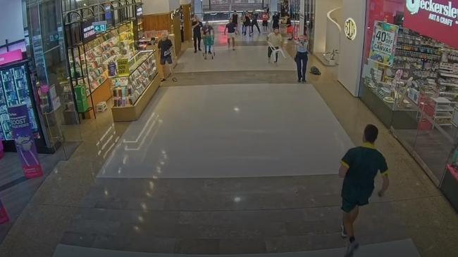 A CCTV still shows killer Joel Cauchi advancing on Inspector Amy Scott as she raises her gun, moments before firing. Picture: Supplied