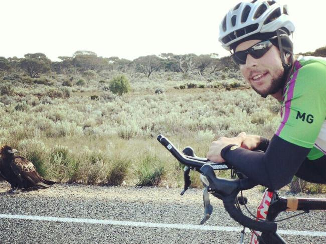 Brad Ellis with a wedge tailed eagle (to left of frame) along the ride from Adelaide to Perth. Picture: Supplied