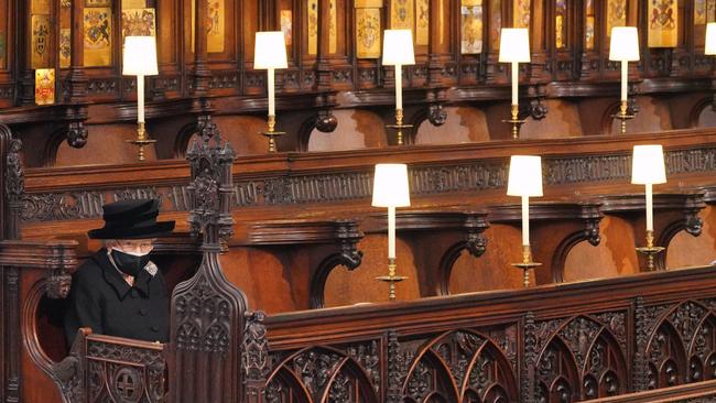 Queen Elizabeth sits alone at Prince Philip’s funeral at St George’s chapel, Windsor. Picture: WPA Pool/Getty Images.