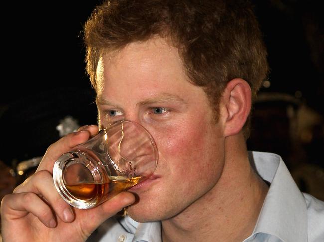 BELIZE CITY, BELIZE - MARCH 02:  Prince Harry enjoys a drink as he attends a Jubilee Block Party on March 2, 2012 in Belmopan, Belize. The Prince is visiting Belize as part of a Diamond Jubilee tour where he will be visiting Belize, the Bahamas, Jamaica and Brazil as a representative of Queen Elizabeth II. Belize is a Commonwealth realm with a population of around 350,000. With the second longest barrier reef in the world and with much of the country covered in tropical jungle with a diversity of wildlife Belize relies heavily on tourism.  (Photo by Chris Jackson-Pool/Getty Images)