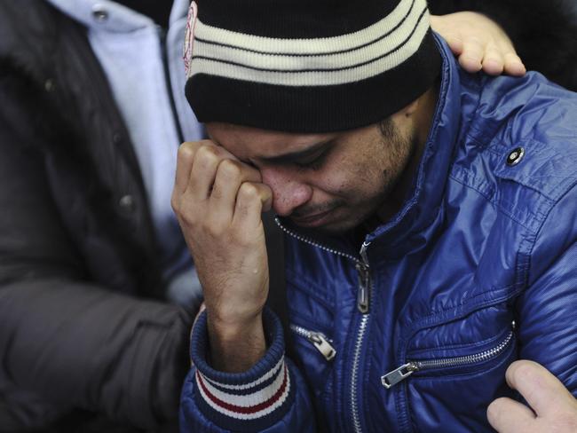 Grief ... A relative of the plane crash victim sobs as he is comforted by other relatives at the Rostov-on-Don airport, about 950 kilometres south of Moscow.  Picture:  AP