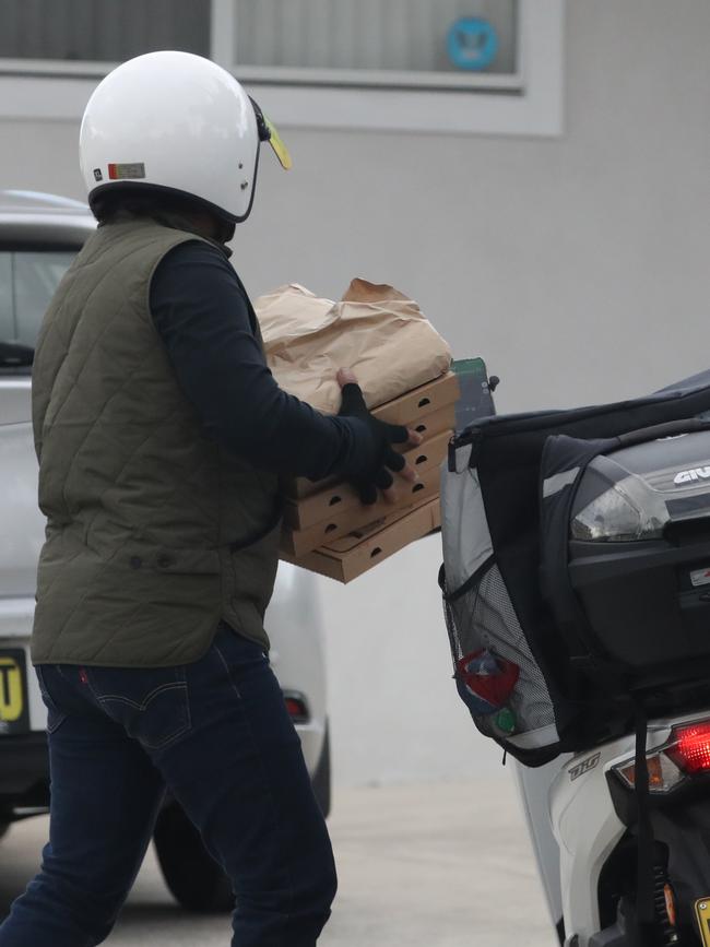 A delivery driver arrives at the Skaf family home on Thursday. Picture John Grainger