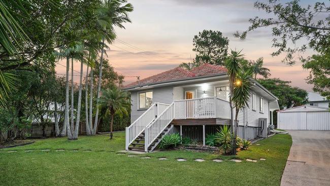 The parents of a young couple were the winning bidders of this property at 59 Buckley St, Carina Heights, at the weekend.