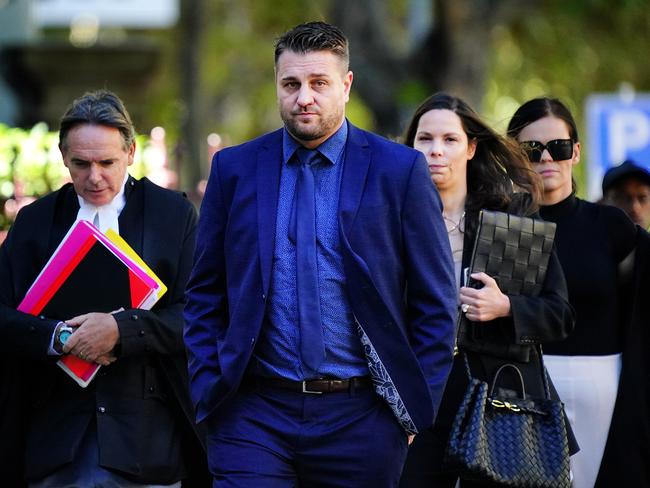 And outside court, flanked by his lawyers, including prominent KC Dermot Dann. Picture: Luis Enrique Ascui