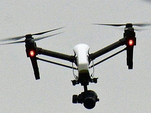 A drone flying in Hanworth Park in west London, as a British Airways 747 plane prepares to land at Heathrow Airport in February 2017. PHOTO: JOHN STILLWELL/ZUMA PRESS