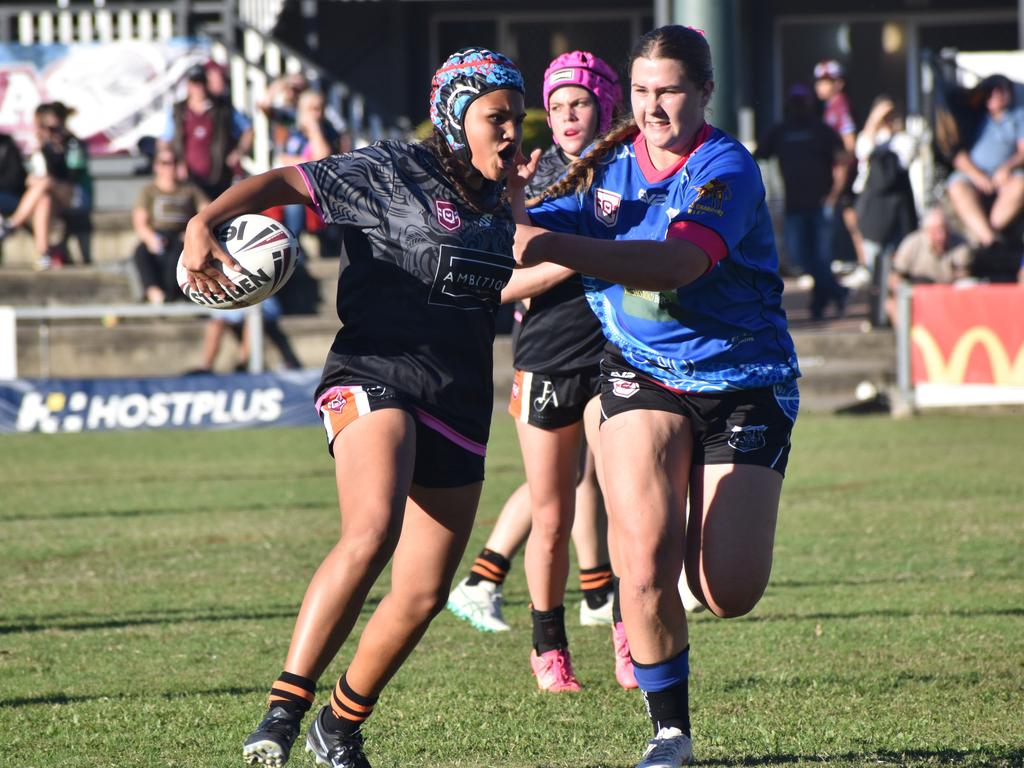 Norths' captain Stevie-Lee Dixson (right) did a mountain of work in defence and then scored the match-winning try in the Rocky Junior League under-17 girls grand final. Photo: Pam McKay