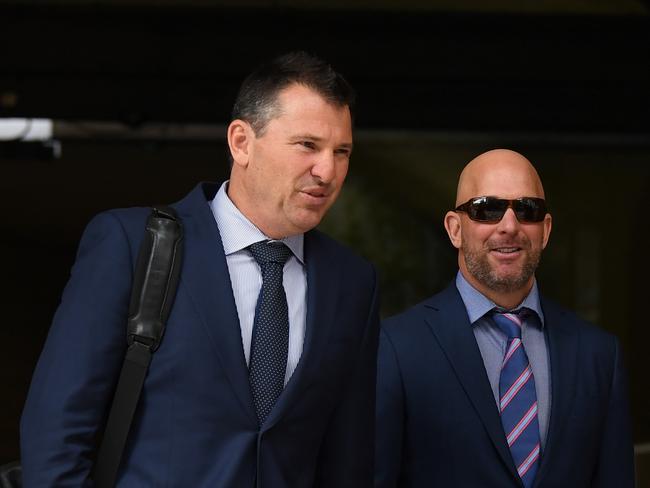 Wayne Geber (right) leaves the Downing Centre Court in Sydney. Picture: AAP Image/Joel Carrett