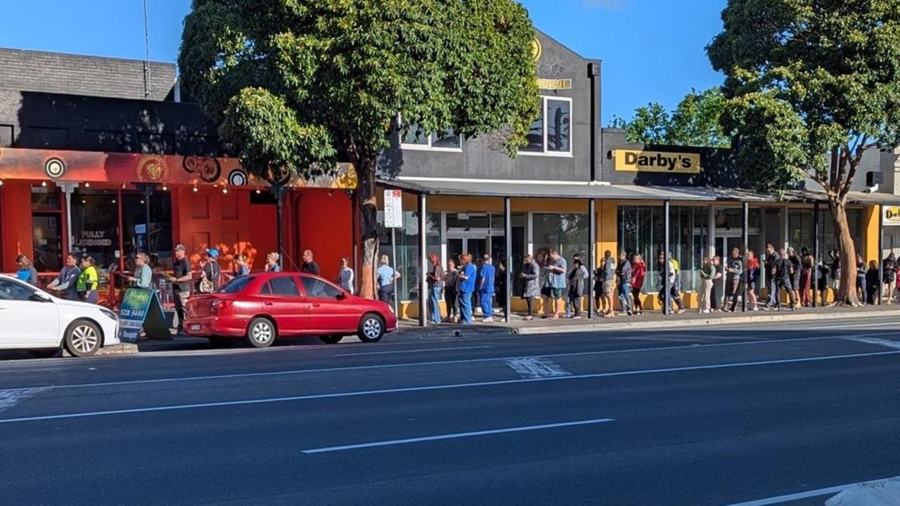 Chaos for late voters as wait times surge past an hour, line wraps around block