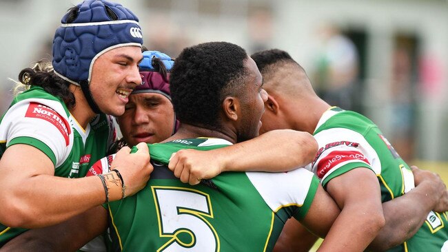 Ipswich fullback Tyler Peckham Harris joins the celebrations.