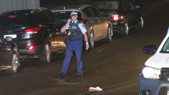 The injured man was assisted by the driver of a garbage truck and another motorist before ambulance paramedics arrived. Picture: Bill Hearne