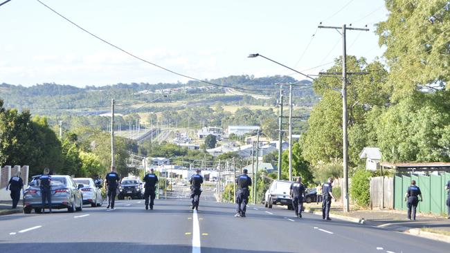 Police search West Street following a fatal shooting on February 26, 2025.