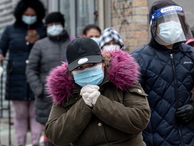 People line up at a food distribution centre in New York. Picture: AFP