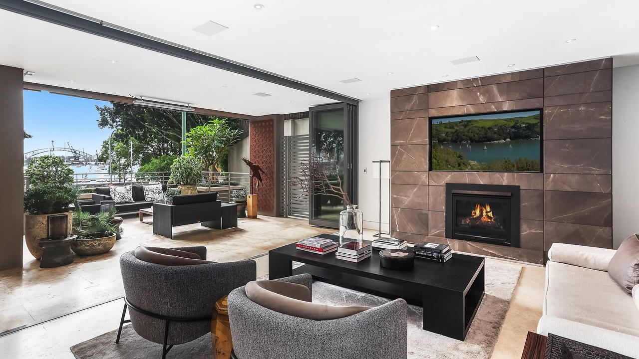 The open-plan living area opens to the terrace with Harbour Bridge views.