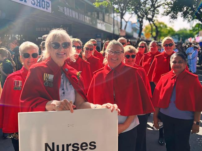 Doned in bright red capes, the nurses made their usual appearance.