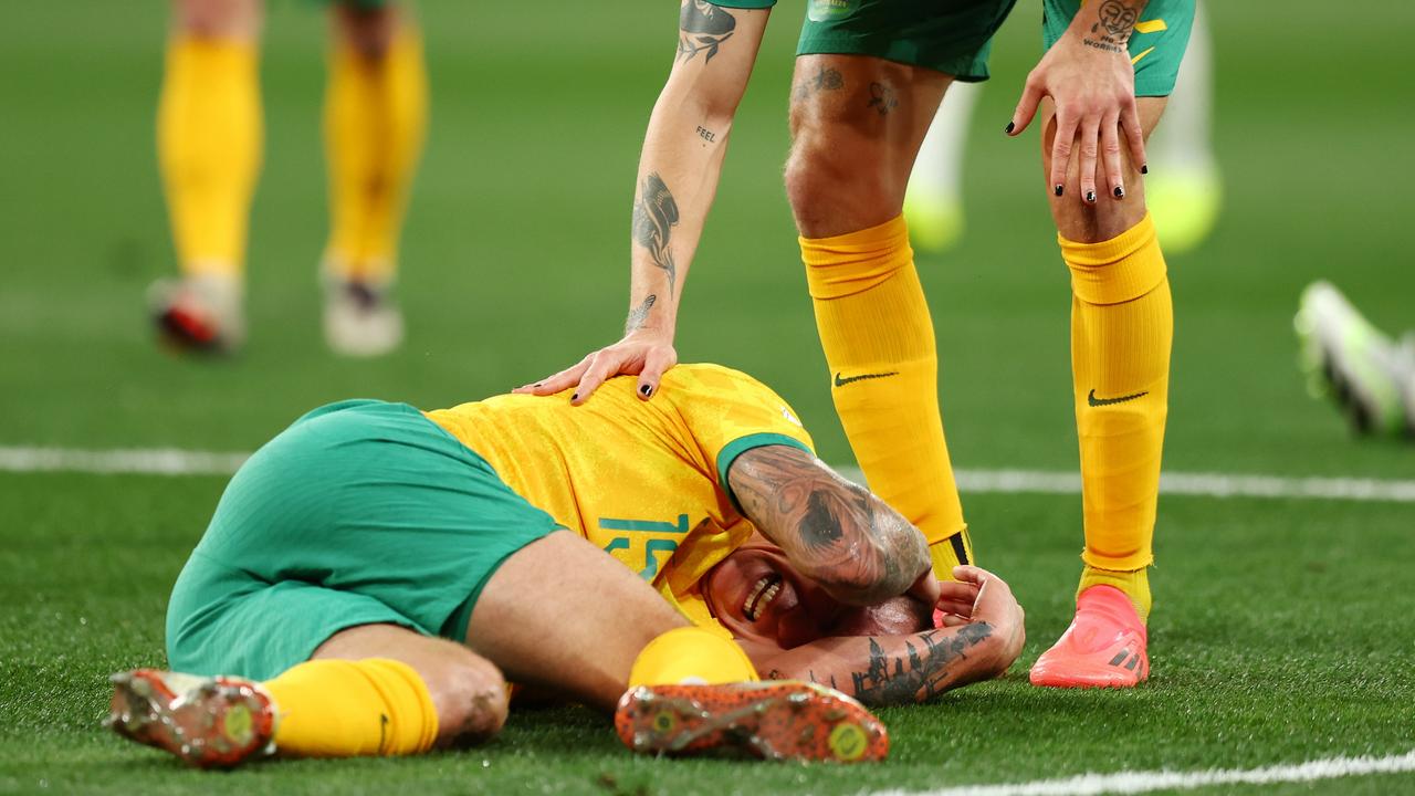 Mitchell Duke of the Socceroos reacts after competing with Ahmed Alkassar of Saudi Arabia. (Photo by Graham Denholm/Getty Images)