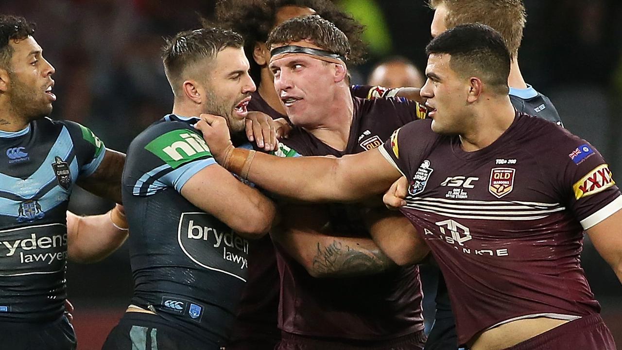 James Tedesco of NSW remonstrates with David Fifita and Jarrod Wallace of Queensland during game two.