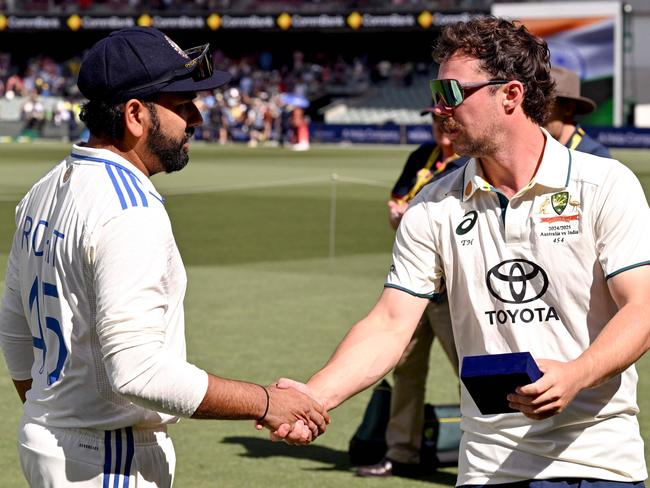 Indian captain Rohit Sharma shakes hands with Travis Head. Picture: William WEST / AFP