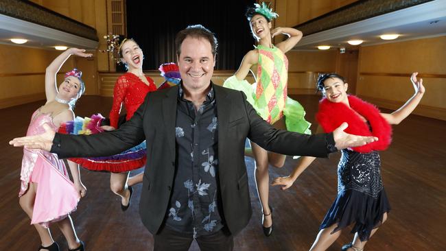 Paul Mercurio, pictured revisiting his famous role in <i>Strictly Ballroom </i>with dancers Alice, 12, Isabel, 13, Sade, 20, and Elana, 12, says Mornington Peninsula performers deserve a professional theatre. Picture: Alex Coppel.