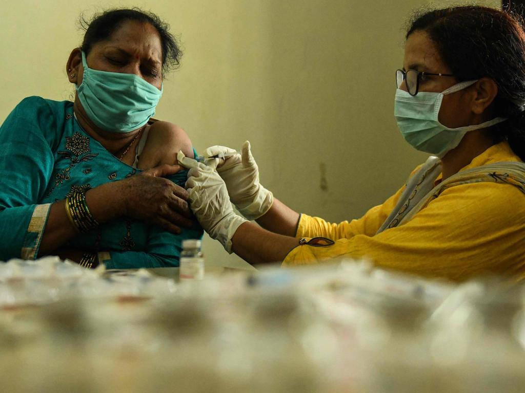 A woman in India is vaccinated against Covid. The hard-hit country has administered close to half a billion vaccinations. Picture: AFP