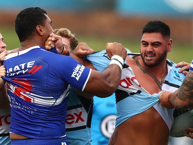 Tevita Pangai Junior (L) will play in round one despite this fiery tussle with Royce Hunt in the final trial. Picture: Mark Metcalfe/Getty Images