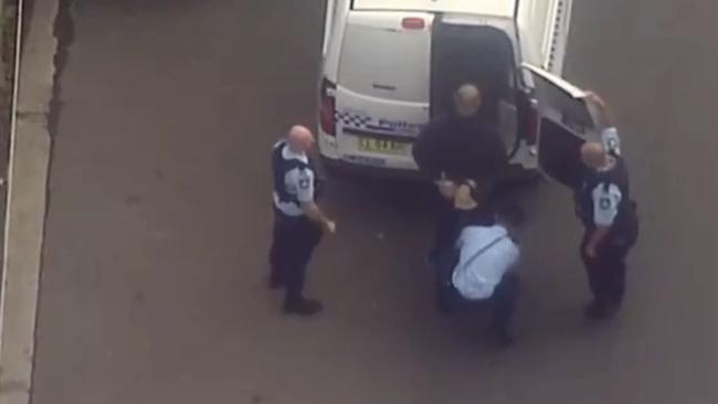 Riot squad officers were seen storming a nearby mechanic warehouse after the men were detained. Picture Seven News