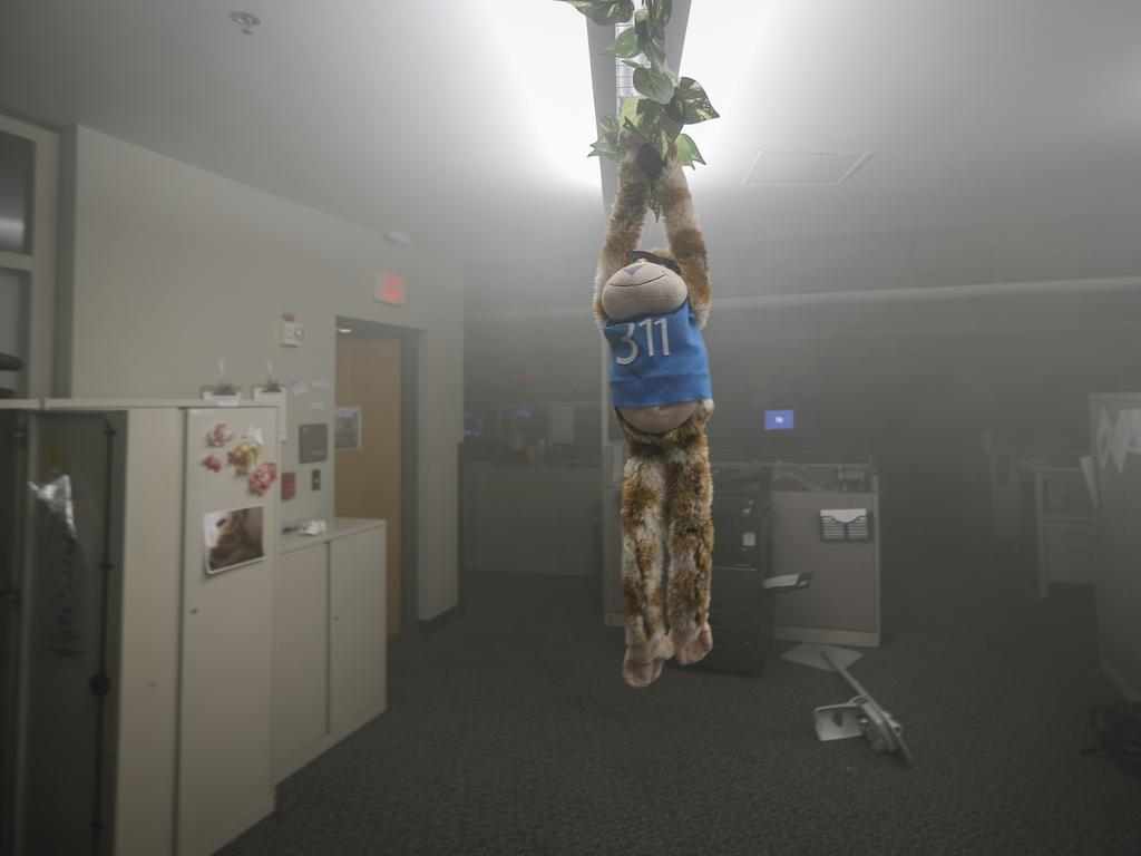 A stuffed toy hangs within the burning Minneapolis 3rd Police Precinct building as smoke fills the room. Picture: AP Photo/John Minchillo