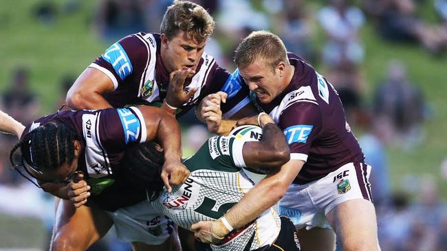 Liam Knight (centre) teams up with Steve Matai and Jake Trojevic smash an Ipswich Jets player in a trial early this season.