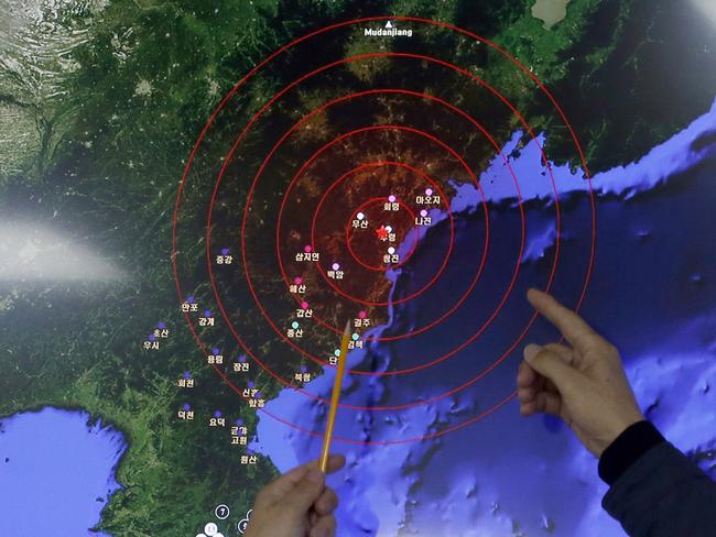 What was felt ... officers from the Korea Meteorological Administration point at the epicentre of seismic waves in North Korea, after it claimed to conduct a powerful hydrogen bomb test. Picture: AP