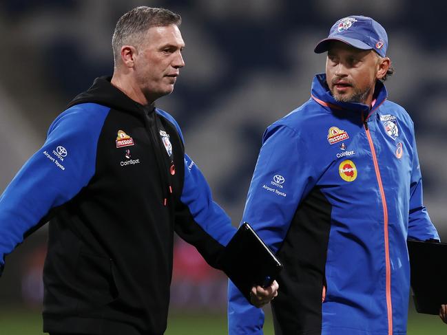 MELBOURNE, AUSTRALIA - August 26 , 2023. AFL .   Western Bulldog assistants coaches Marc Webb and Rohan Smith during the round 24 match between Geelong and the Western Bulldogs at GMHBA Stadium in Geelong, Australia.  Photo by Michael Klein.