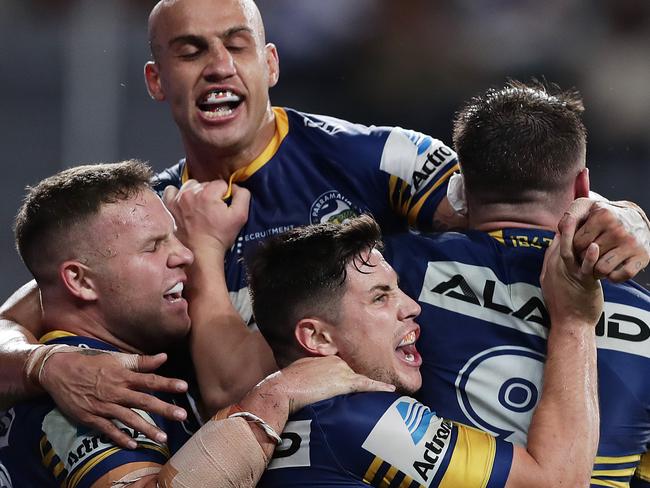 *APAC Sports Pictures of the Week - 2020, March 16* - SYDNEY, AUSTRALIA - MARCH 12: Reed Mahoney of the Eels celebrates scoring a try with team mates during the round 1 NRL match between the Parramatta Eels and the Canterbury Bulldogs at Bankwest Stadium on March 12, 2020 in Sydney, Australia. (Photo by Mark Metcalfe/Getty Images)