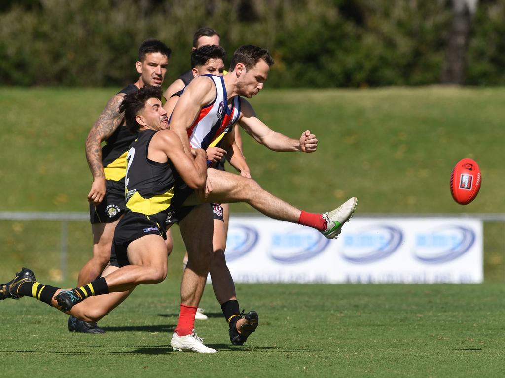 AFL Townsville grand final between Curra Swans and Hermit Park Tigers at Riverway Stadium. Tigers Callaway Parker and Swans Jack Gusmeroli. Picture: Evan Morgan