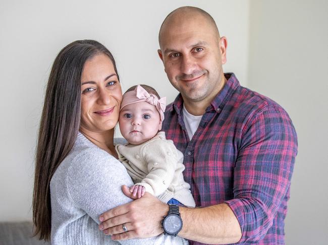 Project manager Carla Knight, 32, and her husband Paul Knight, together with daughter Olivia, 3.5 months, recently merged their private health insurance policies to save money. Picture: Tim Carrafa