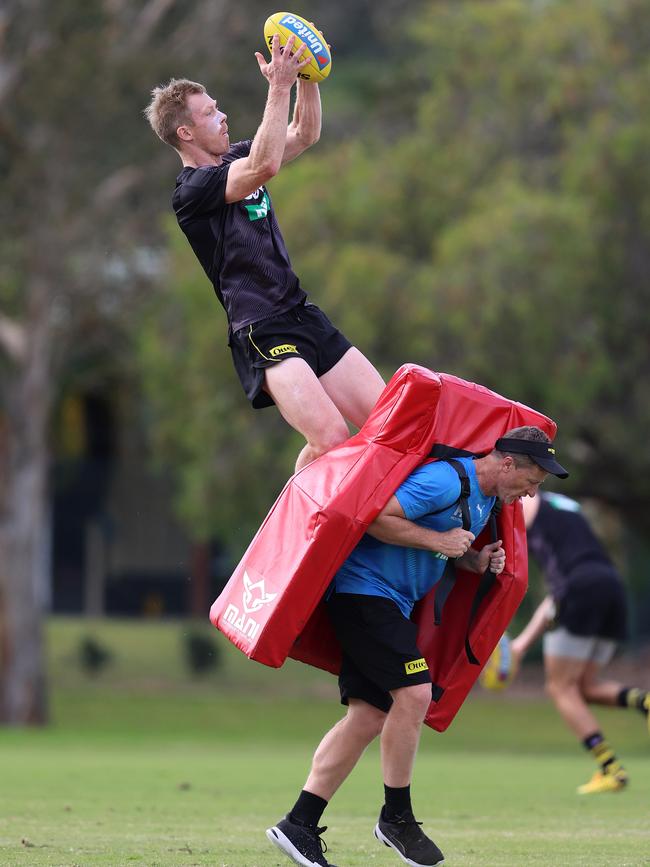 Richmond’s Jack Riewoldt gets in some marking practice over Damien Hardwick at Metricon Stadium on Monday. Picture: Michael Klein