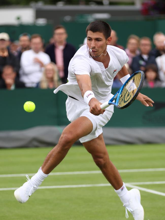 Alexei Popyrin of Australia plays a backhand against Thiago Monteiro of Brazil in his Gentlemen's Singles first round match. Picture: Clive Brunskill/Getty Images