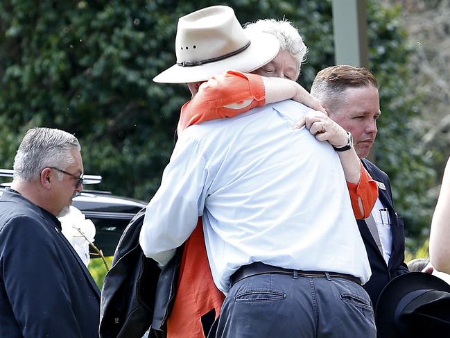 Mourners comfort each other at St Thomas Aquinas, Springwood. Picture: NewsWire / John Appleyard