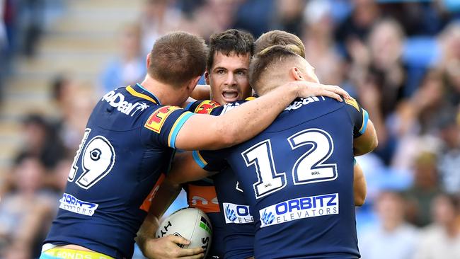 Gold Coast winger Anthony Don celebrates with teammates after scoring a try against Newcastle during their Round 6 clash. Picture: Bradley Kanaris