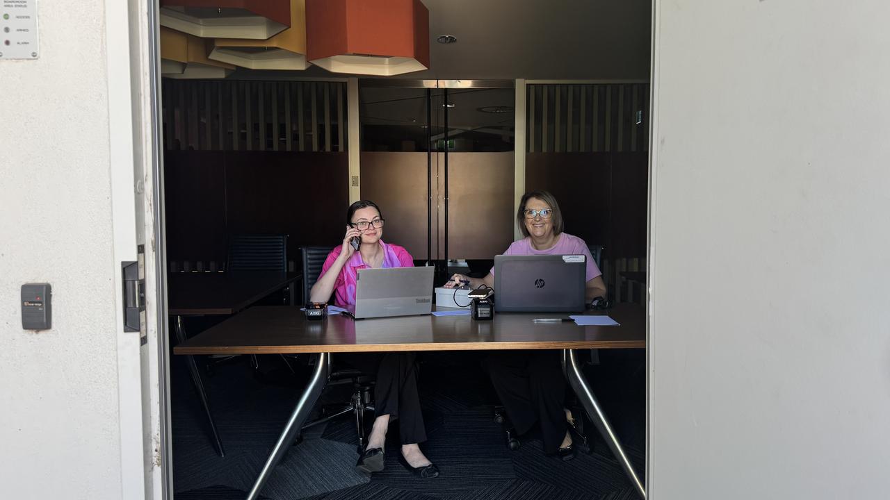 Broken Hill Community Credit Union staff Jordan Fazulla and Kylie Ashwood recreate the scene customers saw on Tuesday amid the blackout. Picture: Supplied