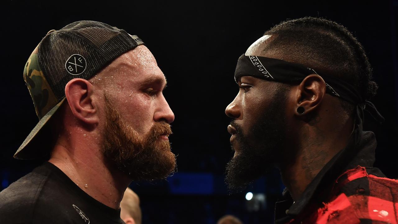 Tyson Fury is confronted by rival boxer Deontay Wilder.