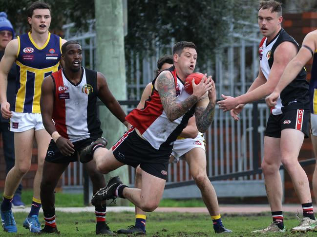 EDFL: Jordan Gloury reels in the mark for West Coburg. Picture: Hamish Blair