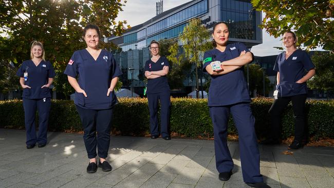 Nurses Chenae Spencer-Attard, Megan Frankenfeld, Ashlee Routley, Arianne Pancho, and Sophie Dohnt in front of the RAH in Adelaide. Picture: Matt Loxton