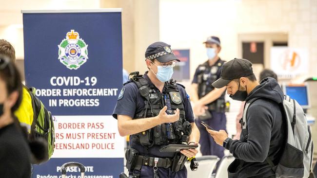 Queensland Police checking Covid border passes at Brisbane Domestic Airport last month. Picture: Richard Walker