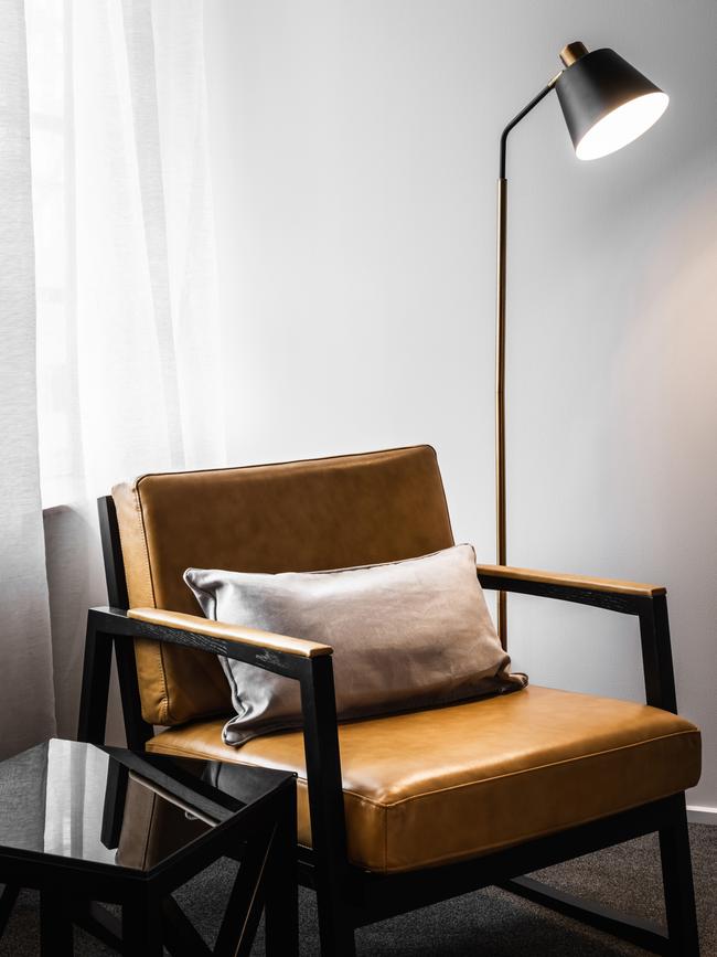 One of the classy reading nooks in Launceston's Hotel Verge in Launceston featuring stylish furniture and brass fittings. Picture: ANJIE BLAIR