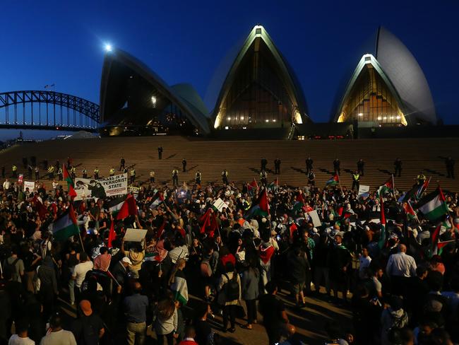 SYDNEY, AUSTRALIA - OCTOBER 09: Palestine supporters rally outside the Sydney Opera House on October 09, 2023 in Sydney, Australia. The Palestinian militant group Hamas launched a surprise attack on Israel from Gaza by land, sea, and air, over the weekend, killing over 600 people and wounding more than 2000, agency reports said. Reports also said Israeli soldiers and civilians have been kidnapped by Hamas and taken into Gaza. The attack prompted a declaration of war by Israeli Prime Minister Benjamin Netanyahu, and ongoing retaliatory strikes by Israel on Gaza killing hundreds in the aftermath. (Photo by Lisa Maree Williams/Getty Images)