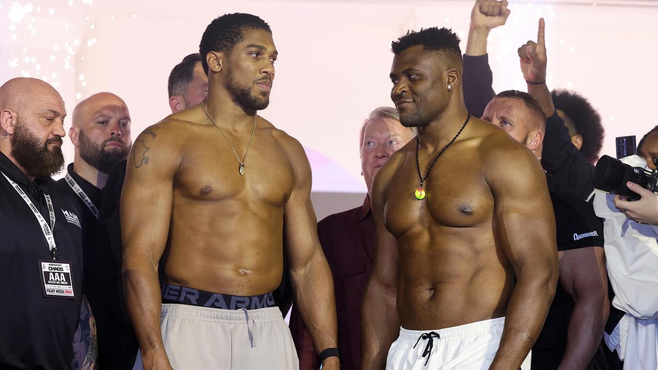 RIYADH, SAUDI ARABIA – MARCH 07: Anthony Joshua (L) and Francis Ngannou (R) interact at the weigh-in ahead of their 'Knockout Chaos' heavyweight fight at Greece in Boulevard World on March 07, 2024 in Riyadh, Saudi Arabia. (Photo by Richard Pelham/Getty Images)