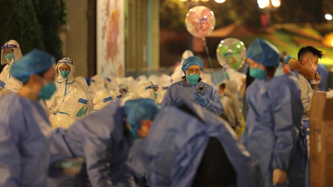 Medical personnel preparing to test visitors for the Covid-19 coronavirus at Disneyland in Shanghai after a single coronavirus case was detected at the park on the weekend. Picture: AFP